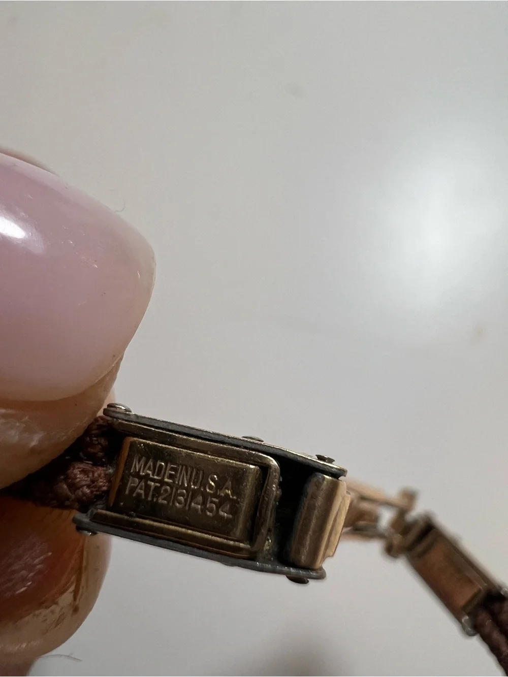 Gruen Precision wristwatch crafted in 14k rose gold with rubies and diamonds